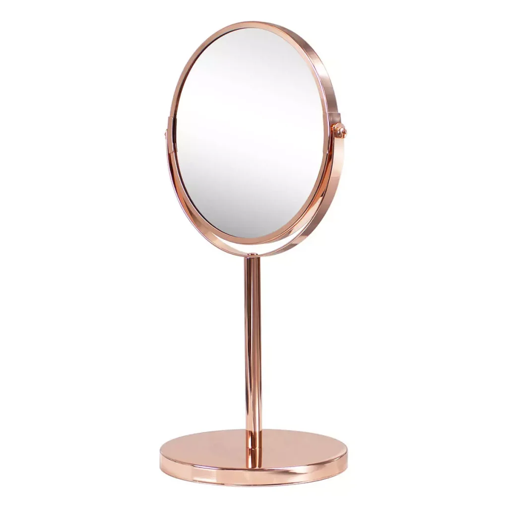 Espejo de aumento sobremesa en acabado bronce/cobre, doble cara con aumentos 1x y 5x, desmontable. Elegante, funcional y perfecto para baños sofisticados.