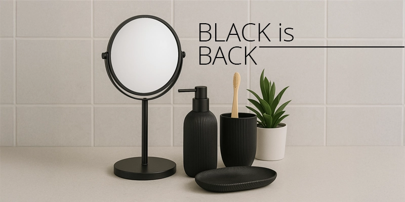 Accesorios de baño en color negro con espejo, dispensador y cepillo de dientes sobre encimera minimalista